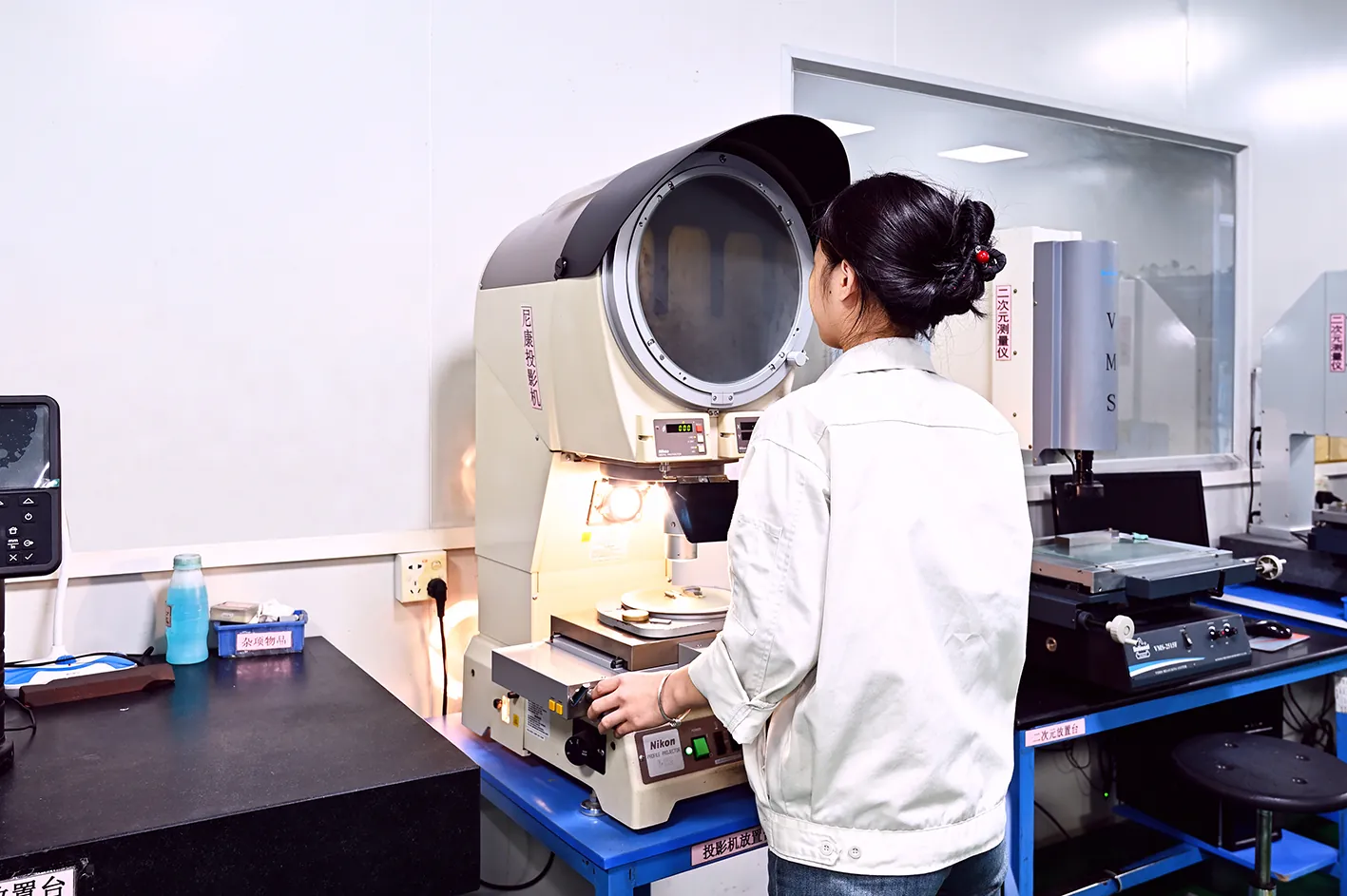 optical profile projector inspecting small mold details - gate and vent verification on an LSR cold runner plate